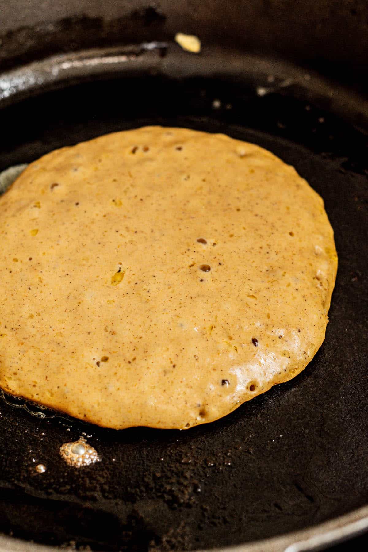 Sourdough pumpkin spice pancakes being cooked.