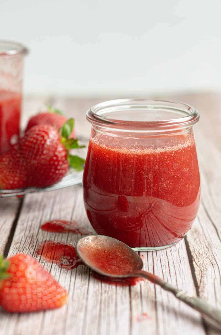 strawberry coulis in jars.