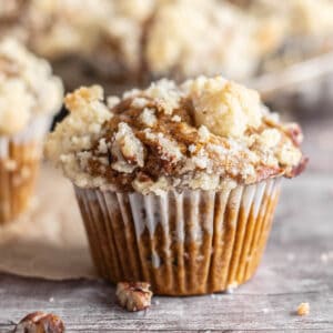 pumpkin streusel muffin with pecans close up.