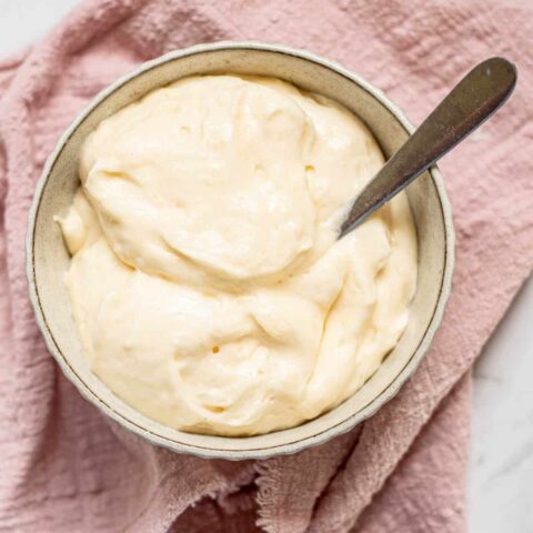 close up of a bowl of whipped chiboust cream.