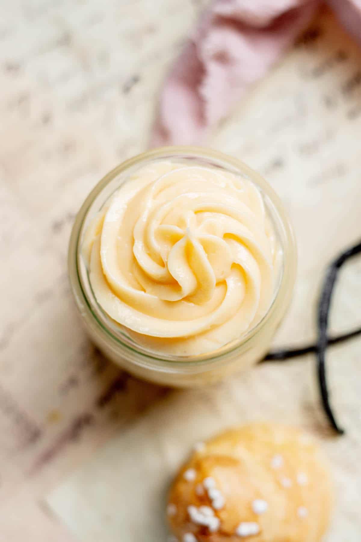 bird's eye view of little jar of swirled crème pâtissière.