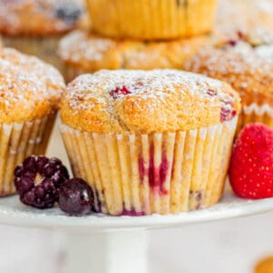 stacked muffins with powdered sugar.