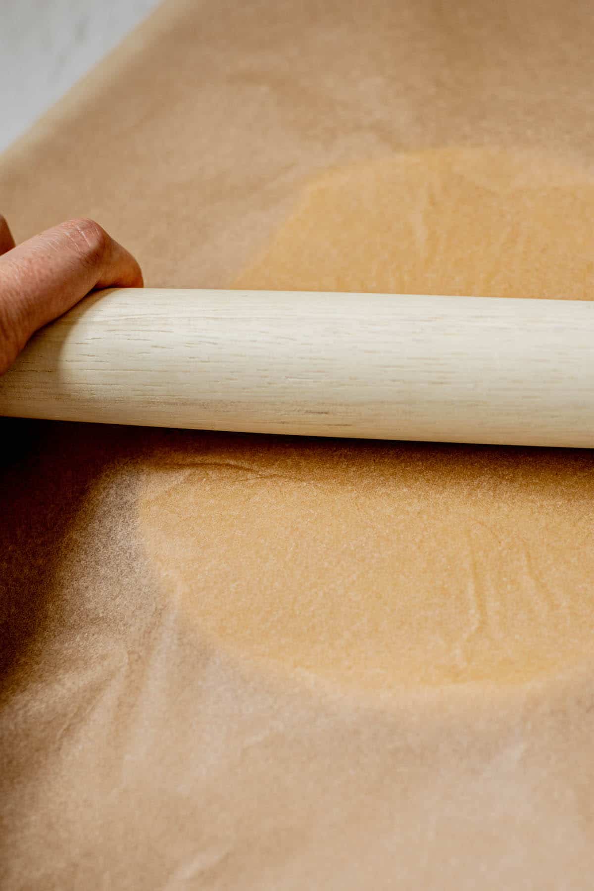 hand rolling pastry.
