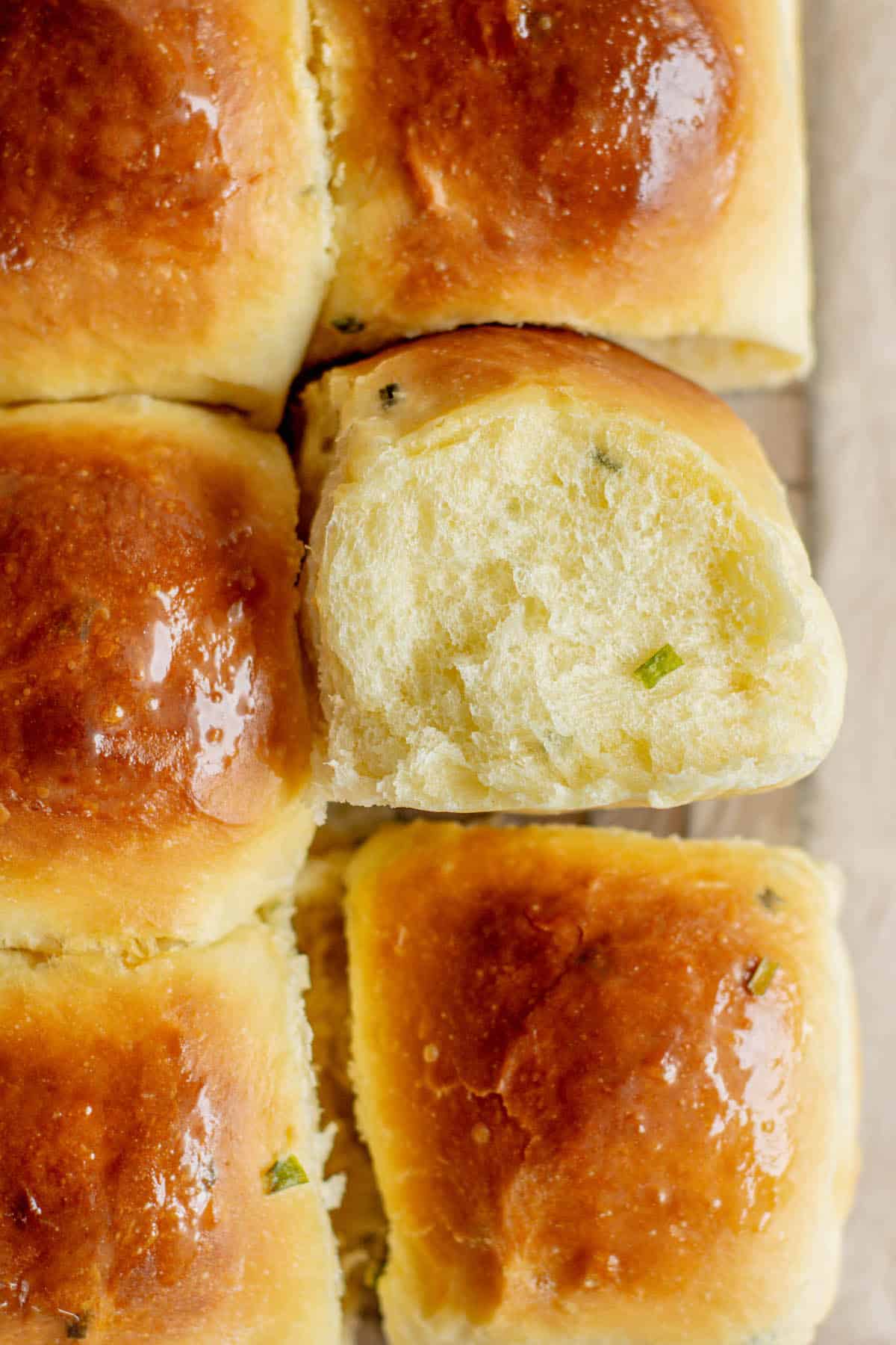 bird's eye view of baked rolls. One roll is flipped on its side.