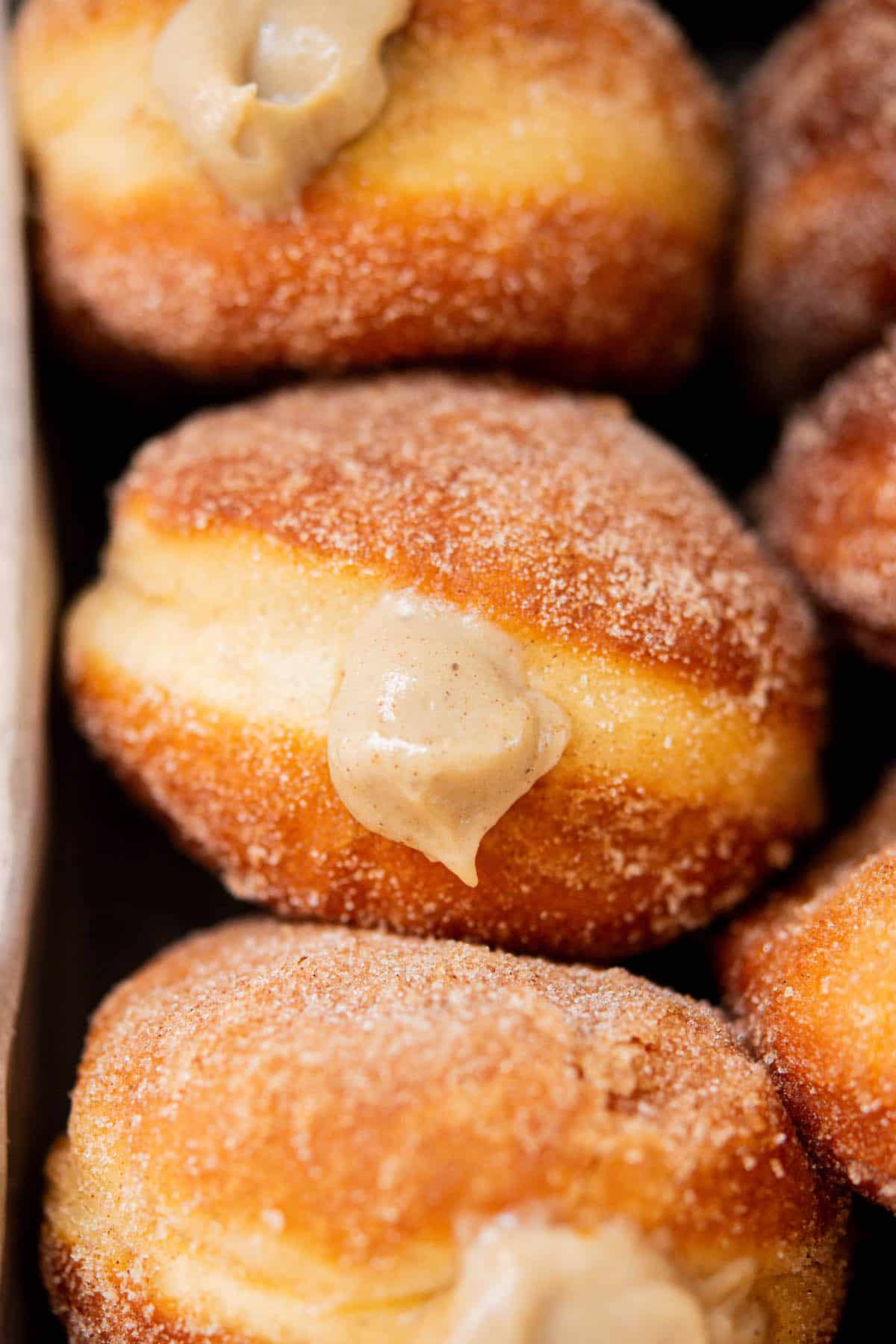 birds eye of gingerbread doughnuts in a silver pan.