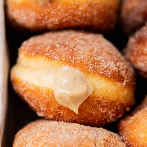 birds eye of gingerbread doughnuts in a silver pan.