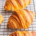 baked croissants on rack.